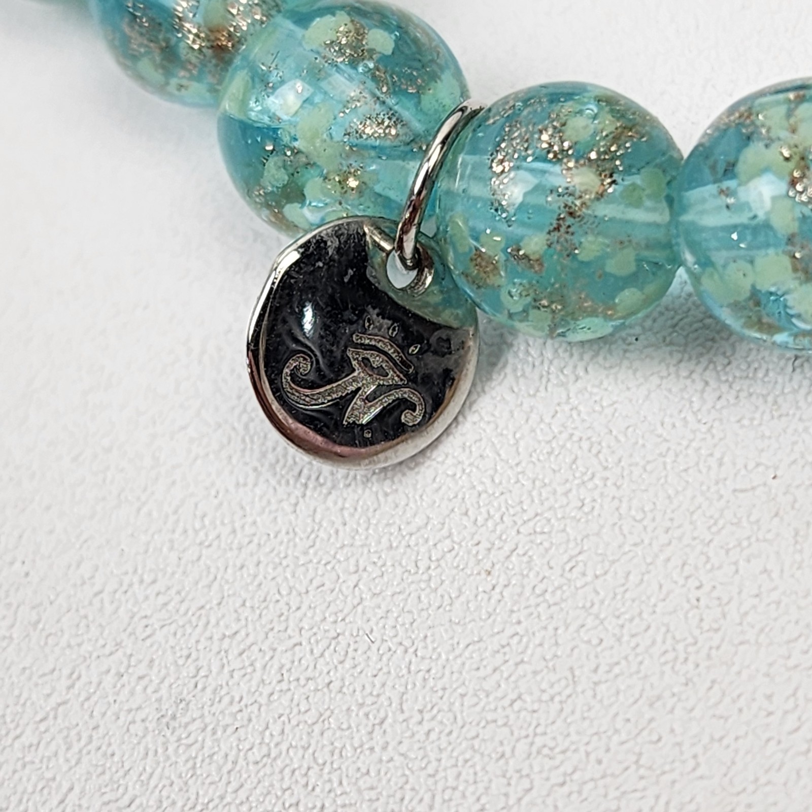 Nogu Teal .925 Sterling Firefly Glow in the Dark Glass Stretch Bracelet NIB