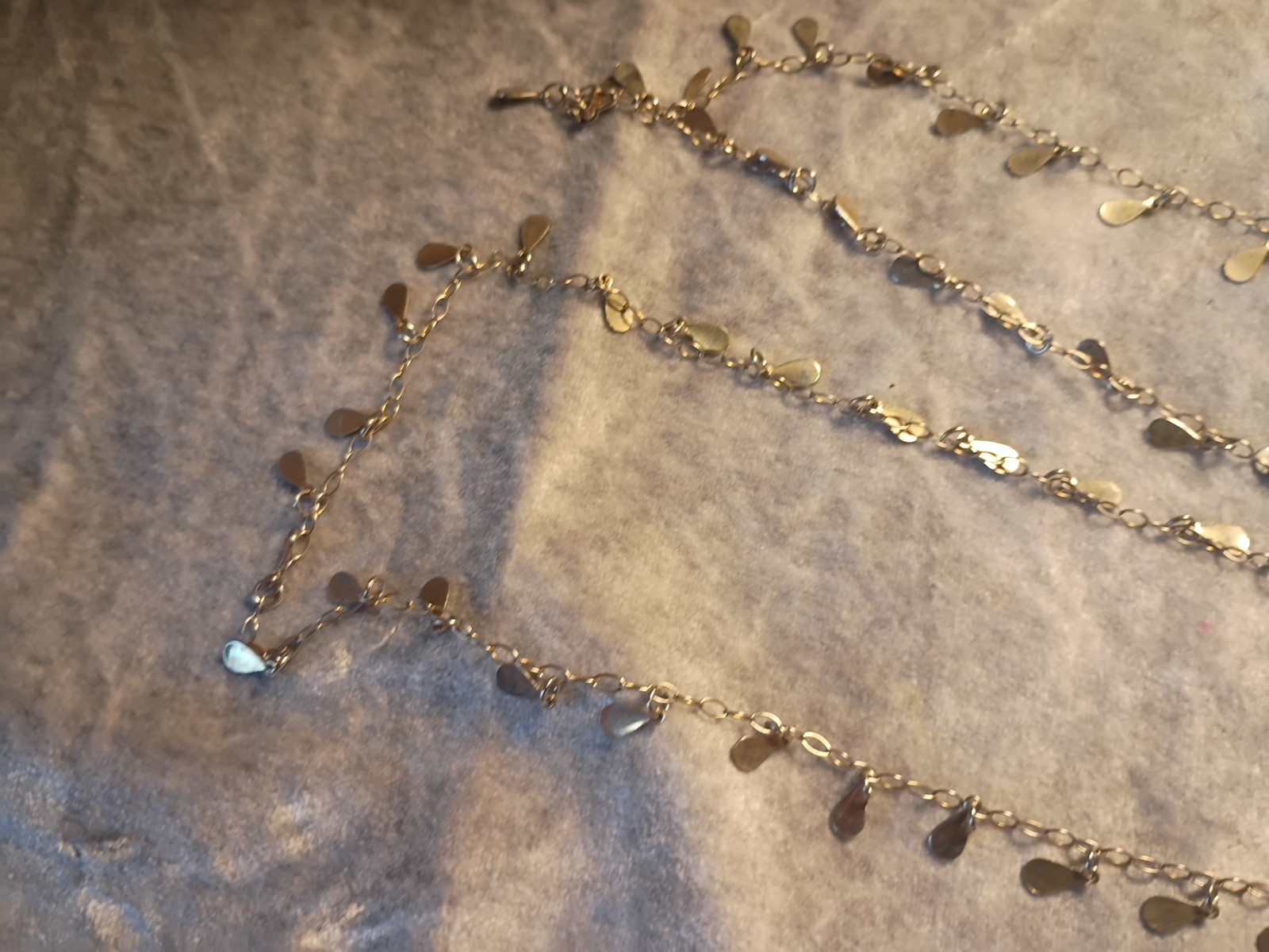 Gold Toned Tear Drop Charmed 56 Inch Taper Single Strand Necklace. J2