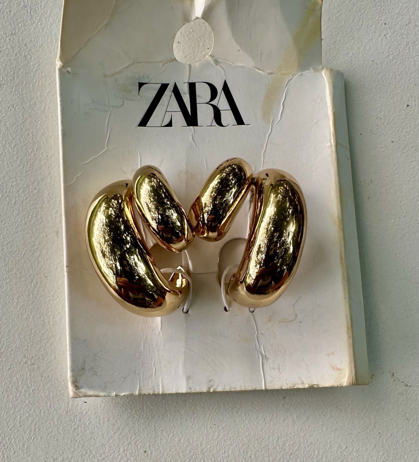 Zara Double Teardrop Earrings in gold.