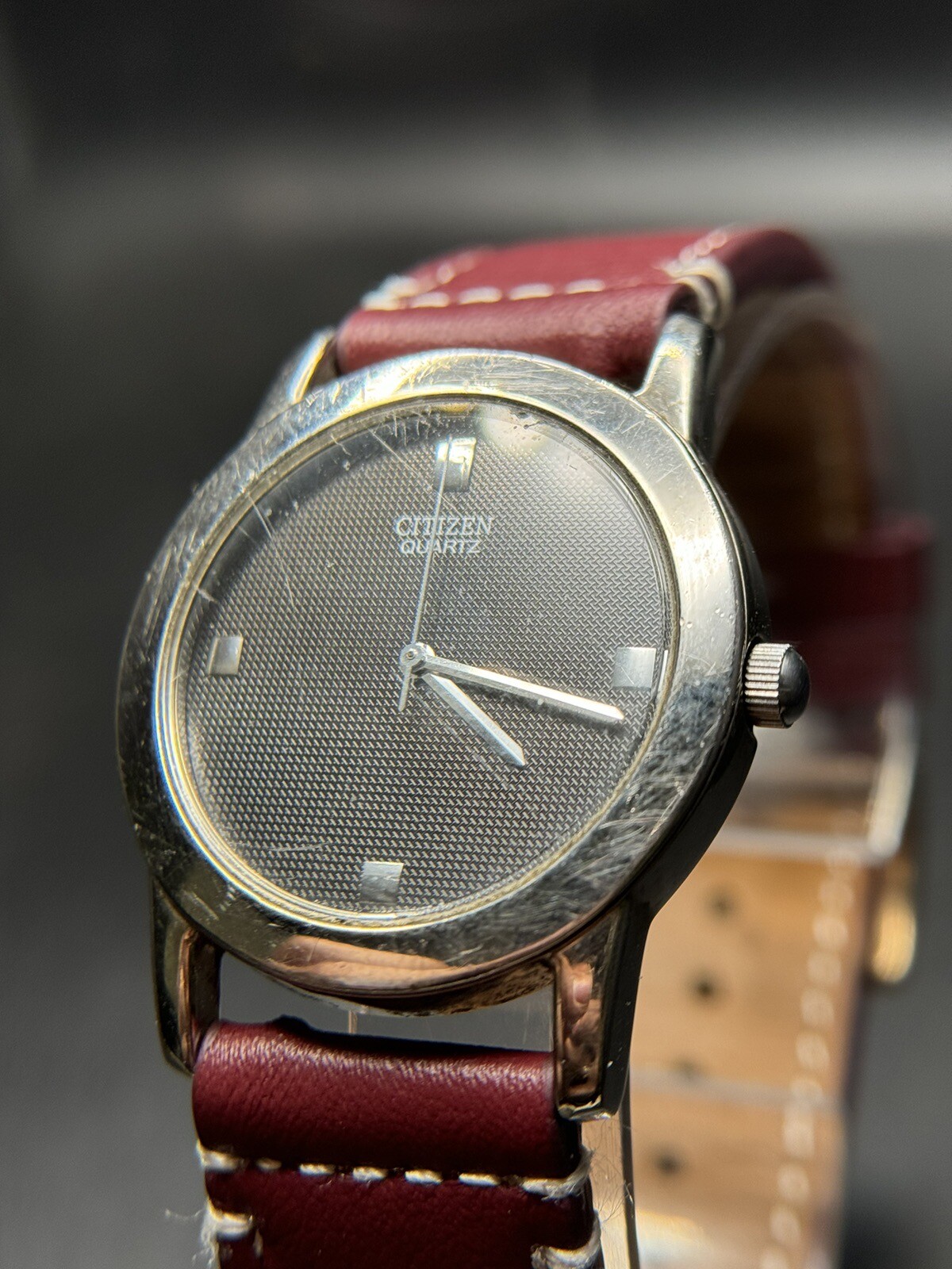 Citizen Quartz Silver Tone Dark Gray Dial Number-Less Watch Burgundy Strap