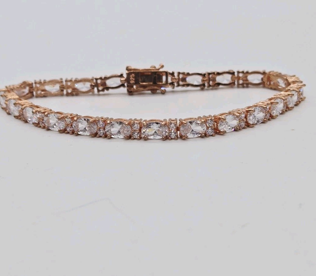 Tennis Bracelet White Oval Crystal rhinestone signed 925 Rose Gold tone 7.25 in