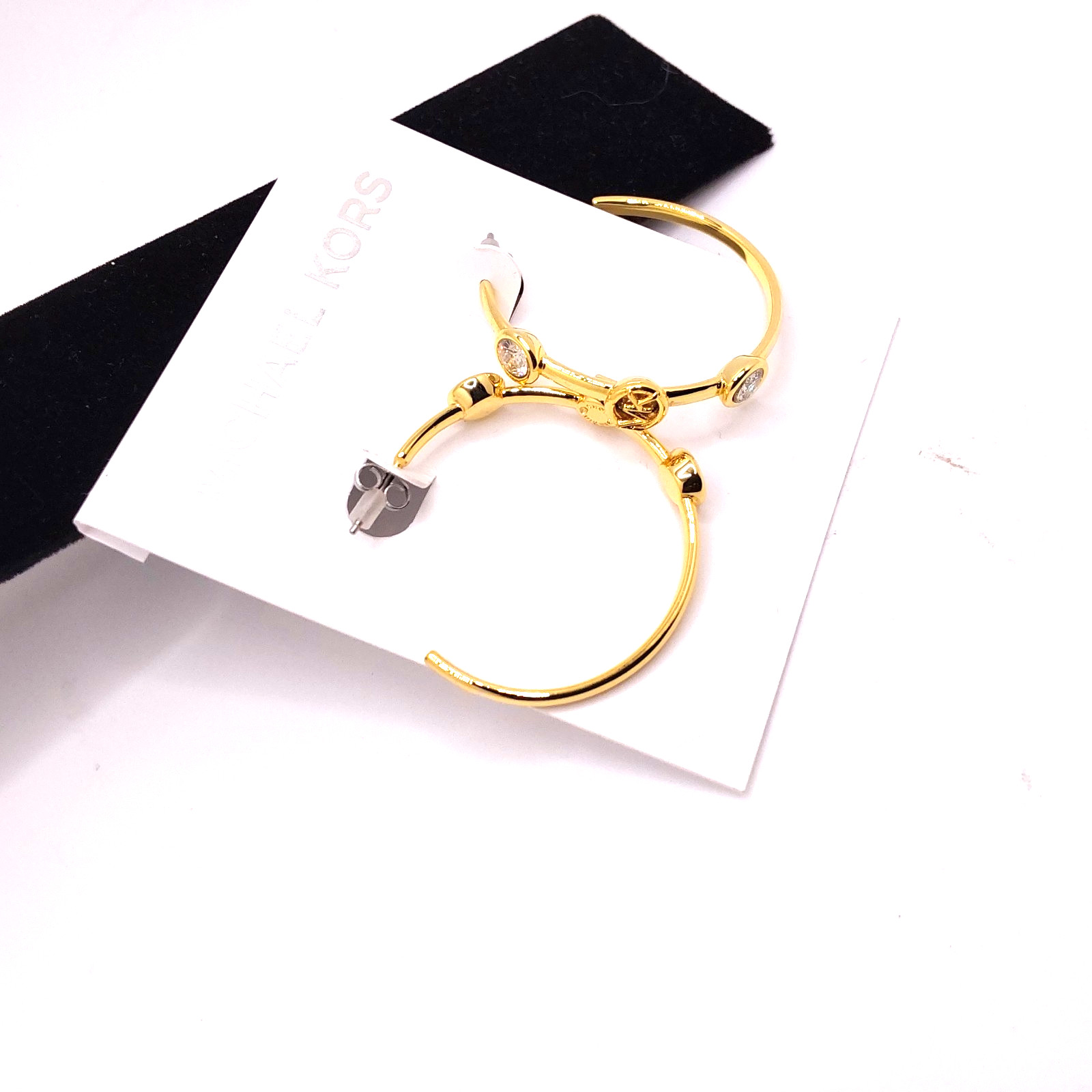 Michael Kors Evelyn Gold Tone Medium Open Hoop Earrings