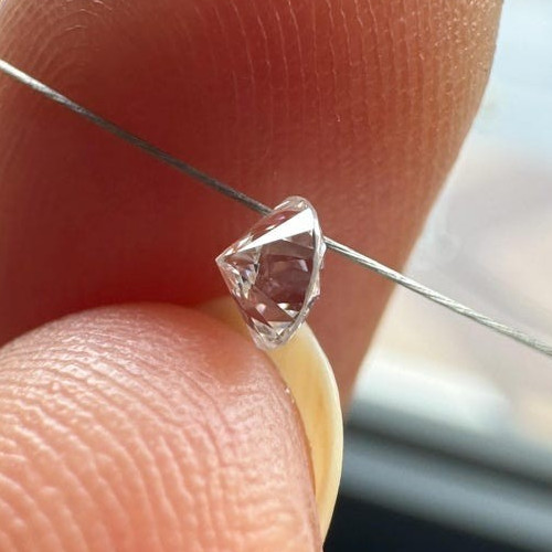 0.60tcw 6pcs EF Color Drilled Round Cut Lab Grown Diamond for Jewelry Creation.