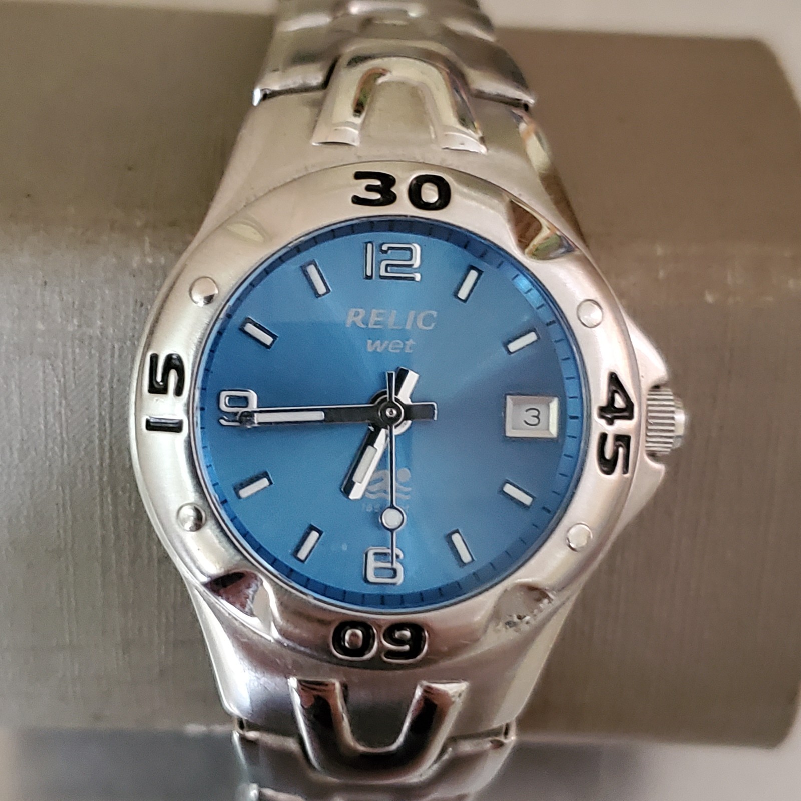 RELIC Wet Watch Women’s Analog Date Blue Dial Rotating Bezel Stainless 6 in 31mm