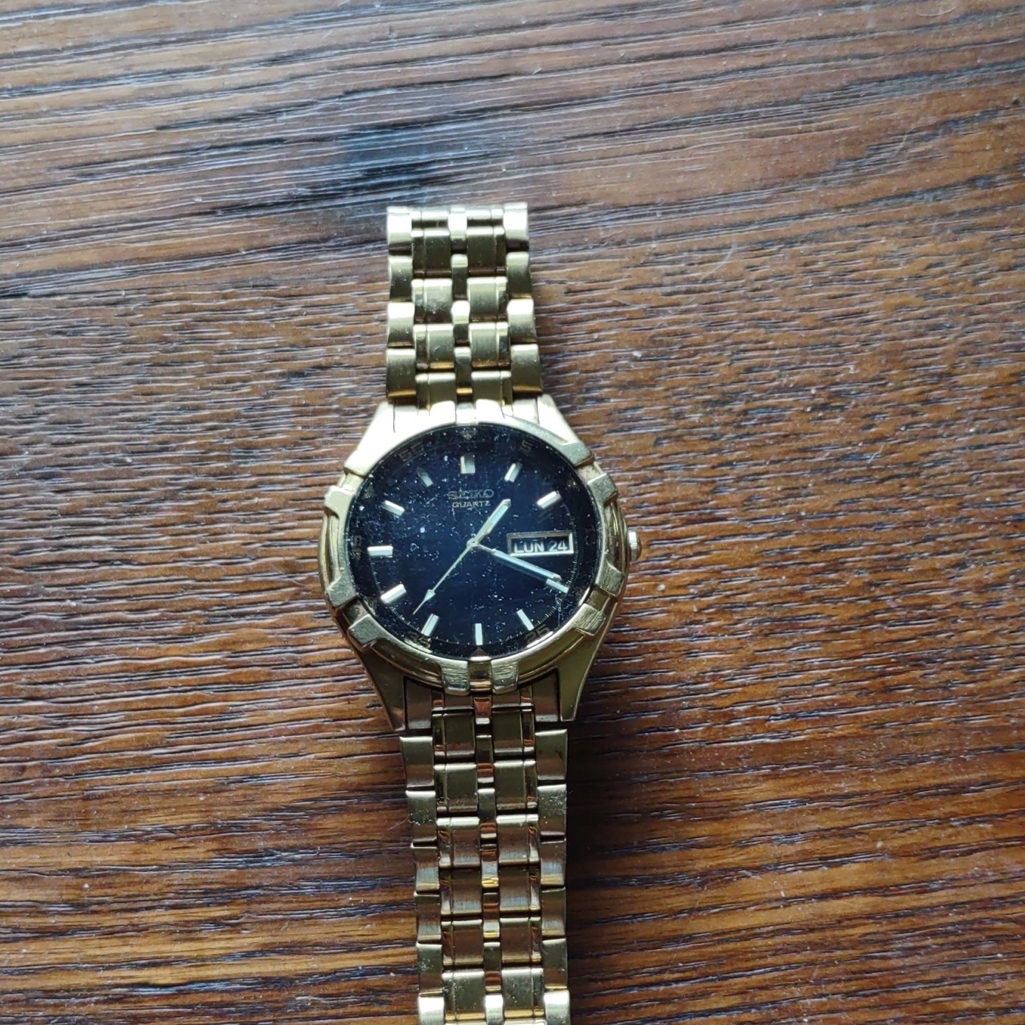 Seiko Quartz Day/Date Black Dial Gold-Tone Stainless Steel Bracelet Watch