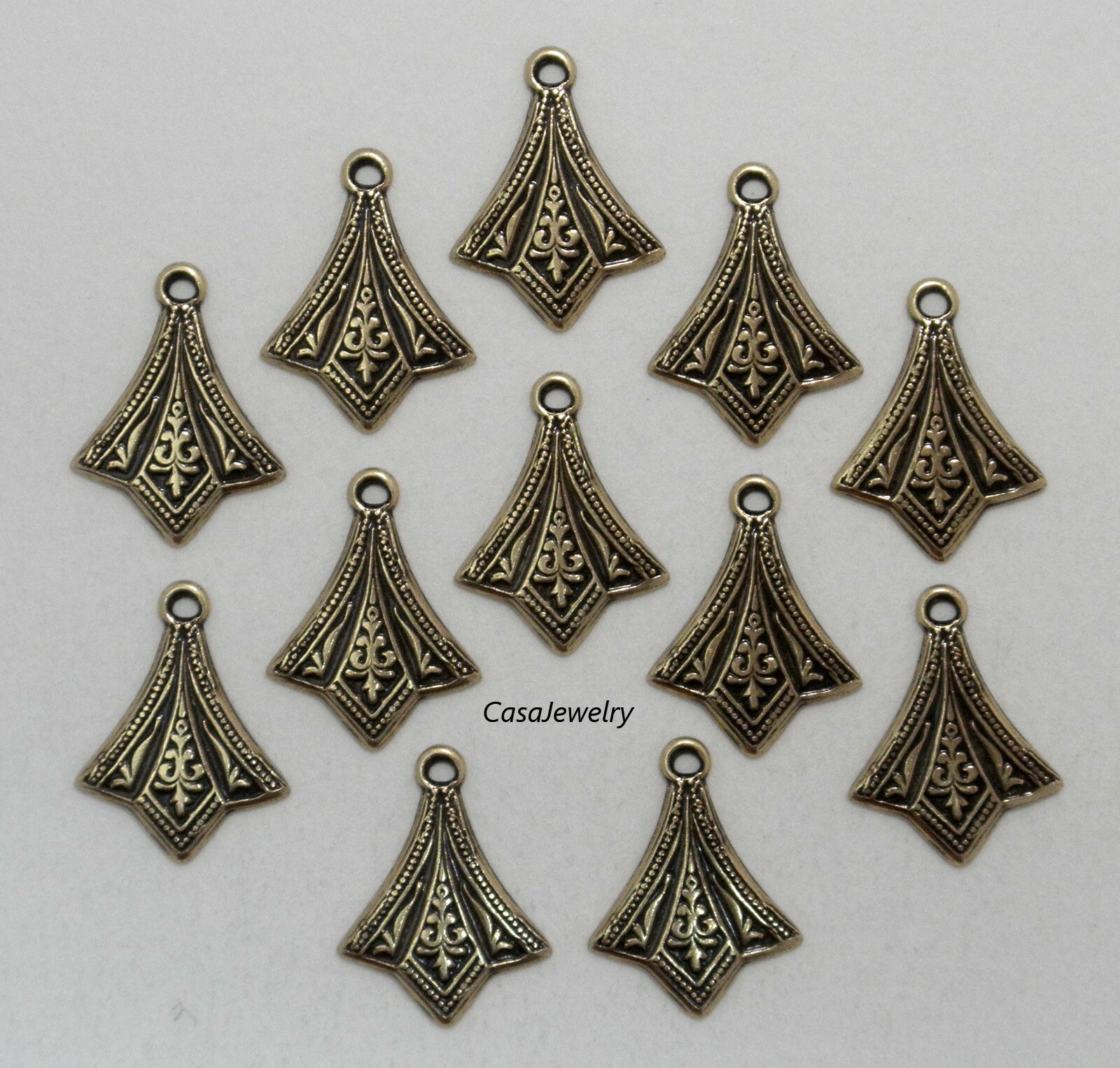 #3414 ANTIQUED GOLD SMALL DIE STRUCK ADORNMENT W/TOP HANG RING – 12 Pc Lot