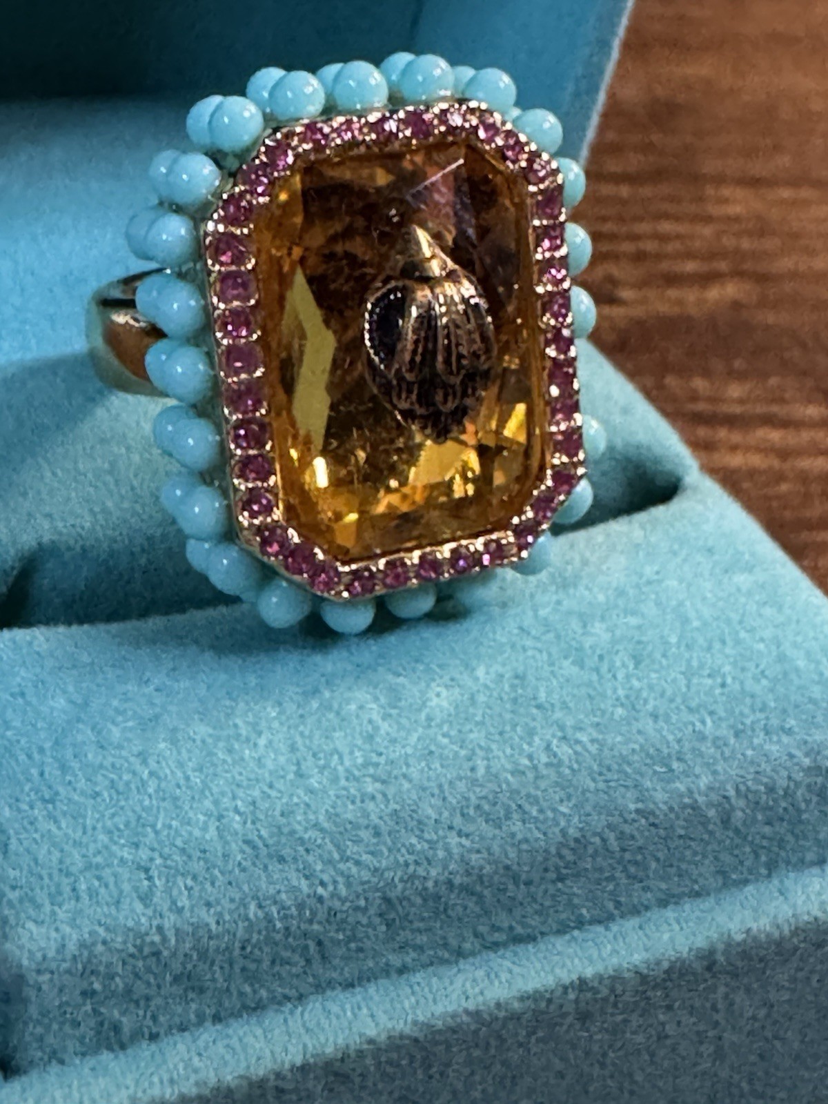 KURT GEIGER LONDON GOLD TONE EMERALD CUT COCKTAIL EAGLE HEAD RING IN ORANGE 7