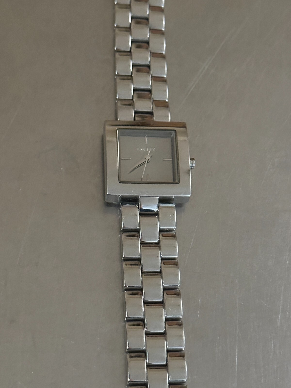 DKNY Watch Women’s Analog Square Silver Tone Quartz Water Resistant 7 inch 22 mm
