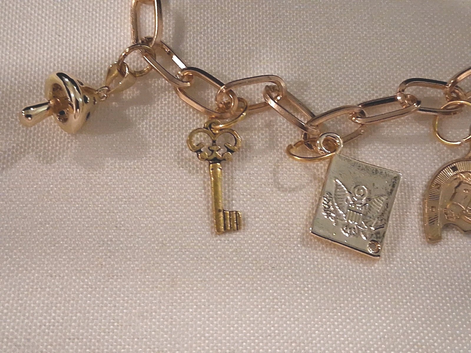 Goldtone Dangle Charm Bracelet, 6 Charms:Horse,Crown,Keys,Mushroom& Amer. Eagle