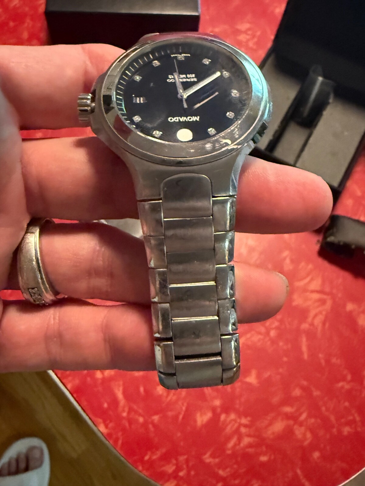 MOVADO 800 SERIES WATCH WITH BLCK BEZEL AND DIAMOND MAKERS – MENS WATCH