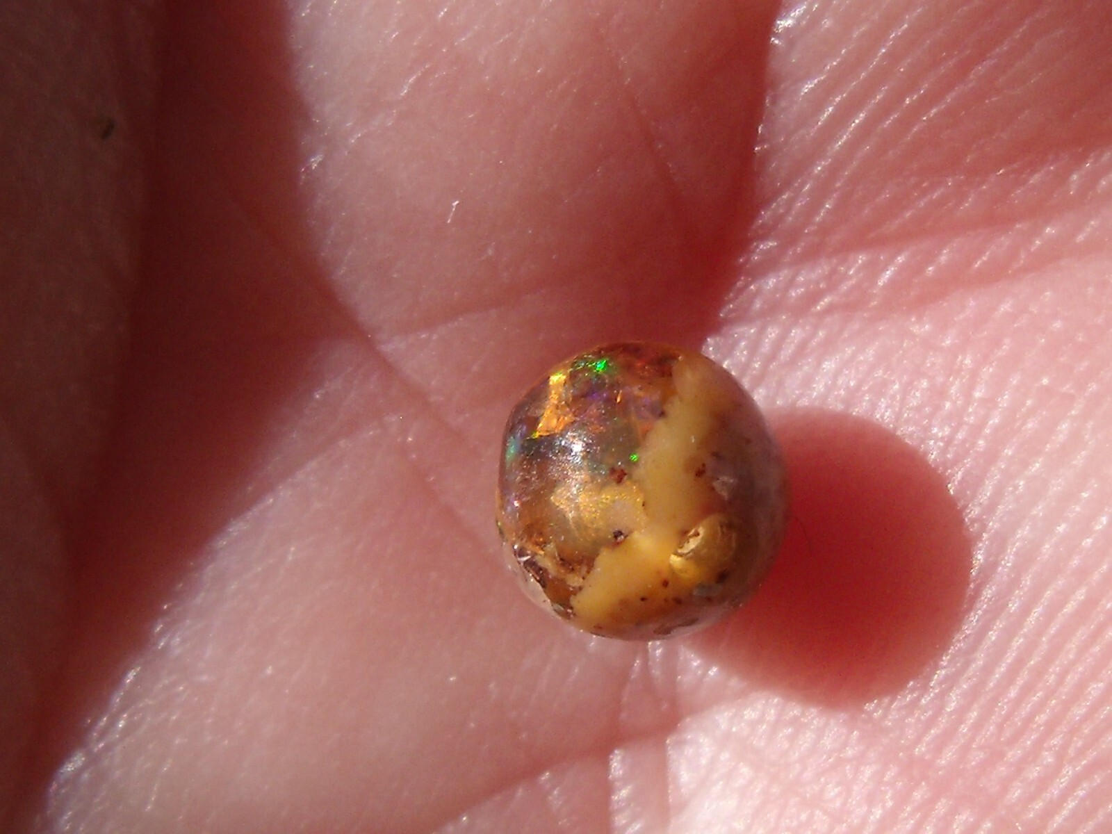 0.82 Ct. Round Cut Mexican Cantera fire opal bead.