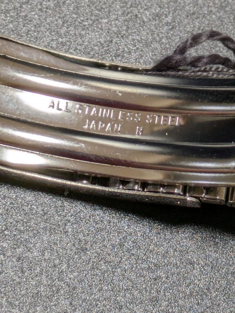 SEIKO stainless steel simple metal band with tag.
