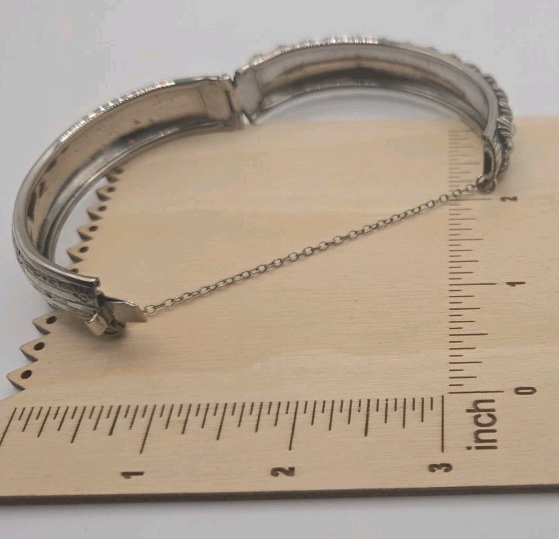 Silver Tone Hinged Bangle Bracelet Ornate And Embossed With Safety Chain 8″