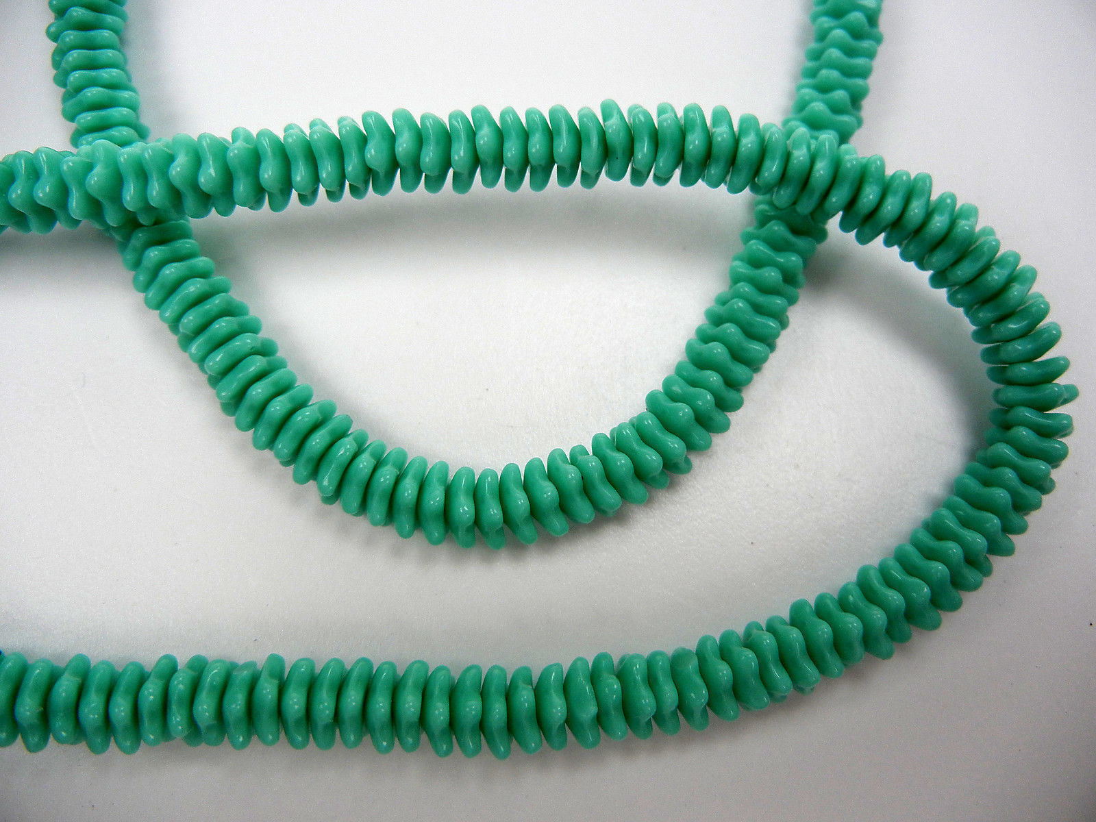 192 Czech glass flat flower star bead cups 7x3mm Opaque Green, 16 inch strand