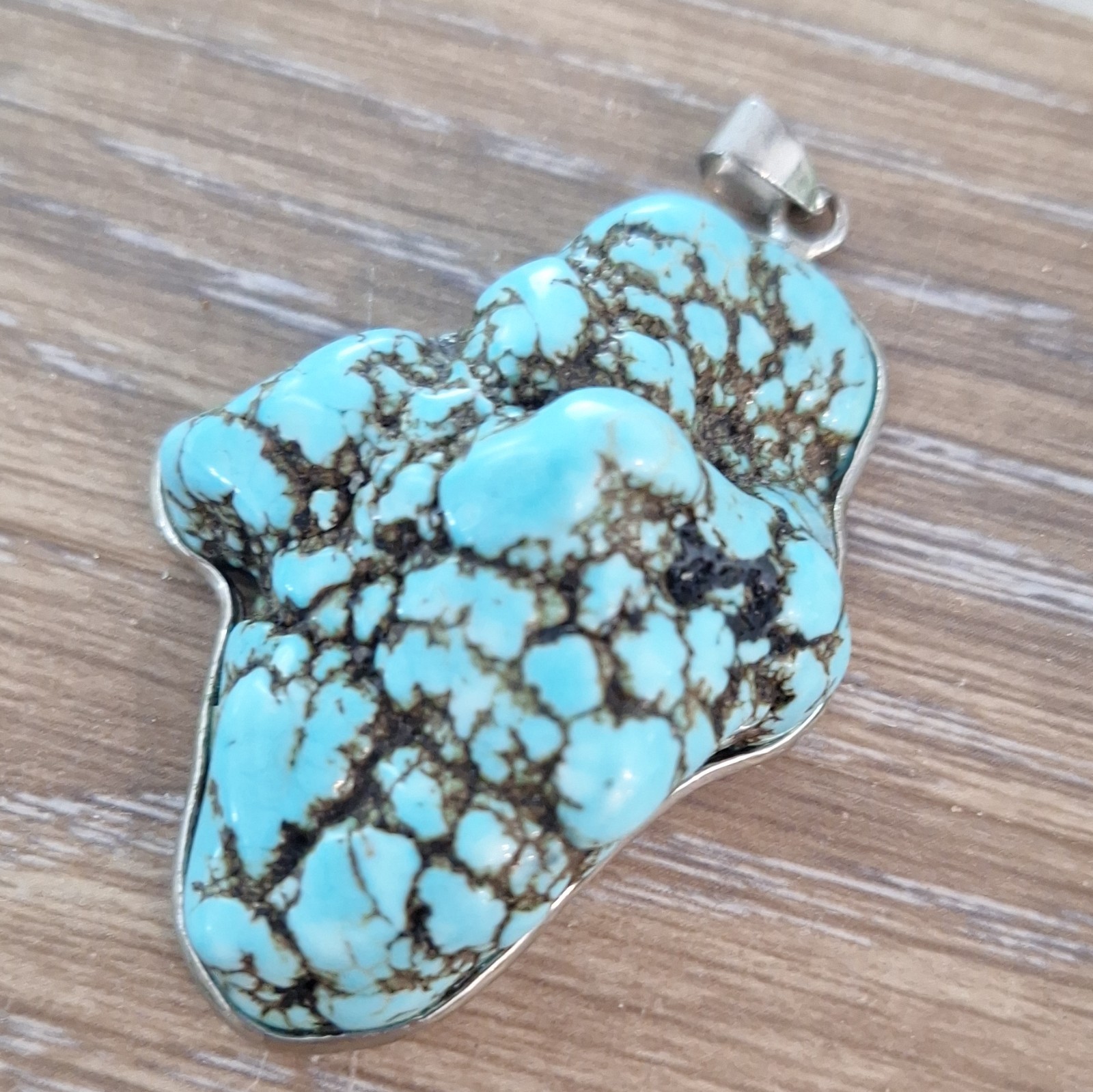 Blue turquoise Stone Pendant Charm with silver outline.