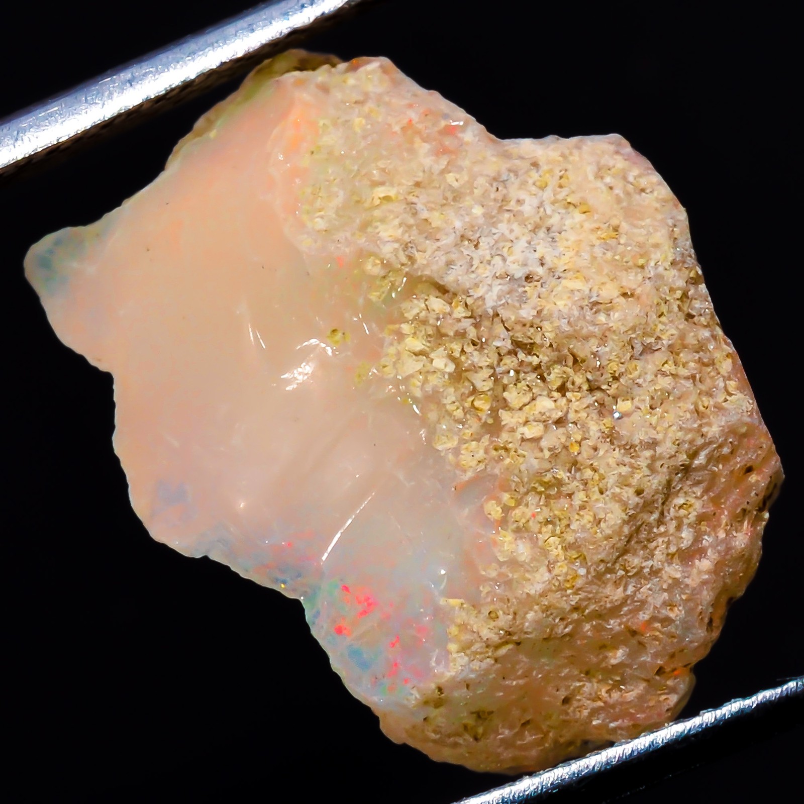 Natural play of color Ethiopian Opal rough gemstone 9.05 Carat. (16 x 21 x 6 mm)