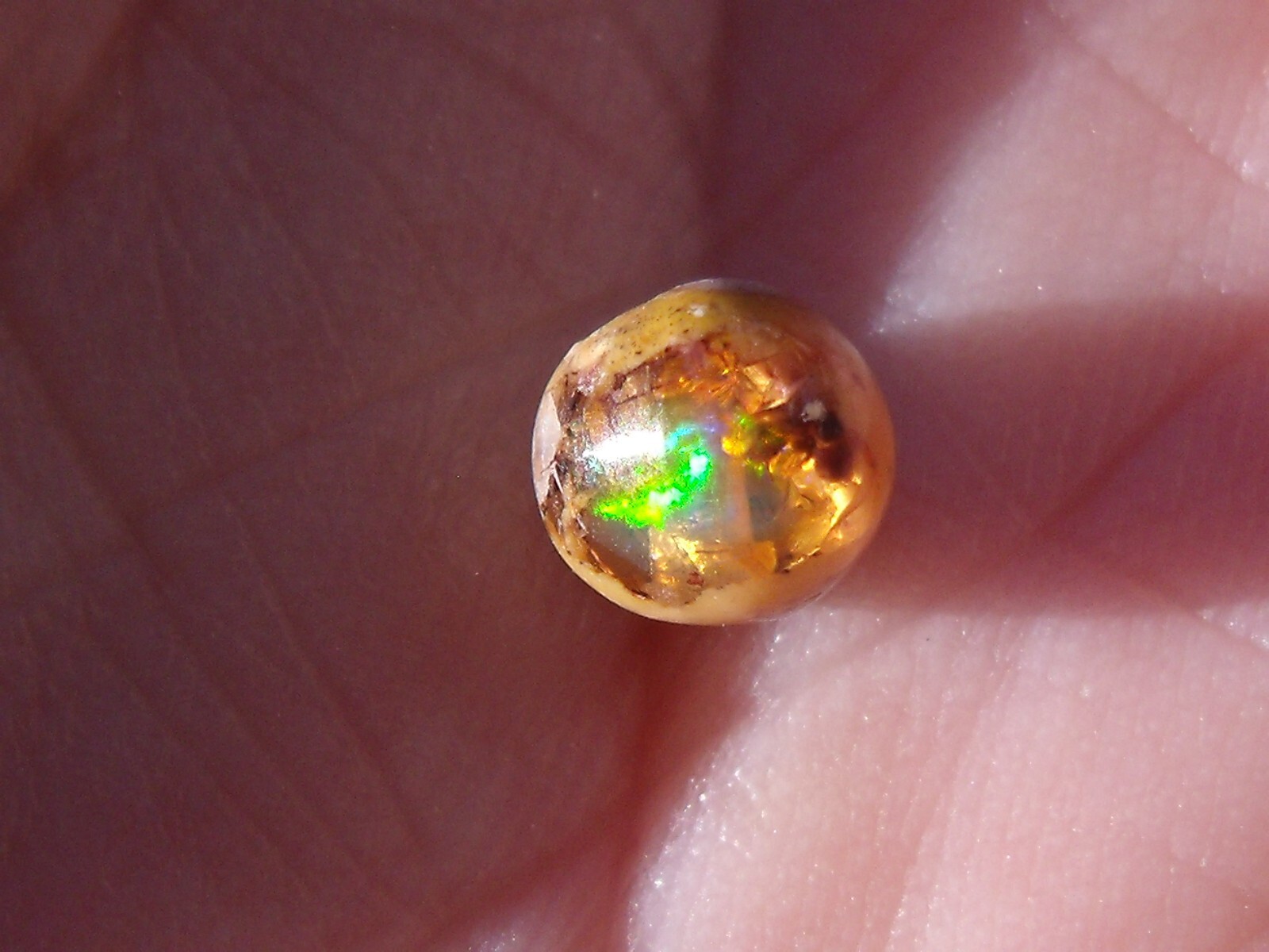 0.82 Ct. Round Cut Mexican Cantera fire opal bead.