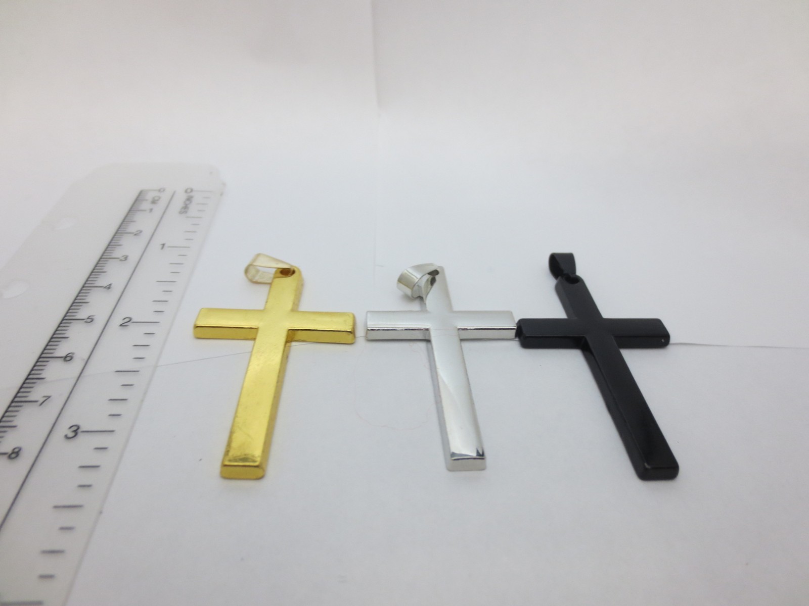 GOLD/SILVER/BLACK STAINLESS STEEL CROSS ALMOST 2 1/4″ HIGH BY 1 1/4″ WIDE P15