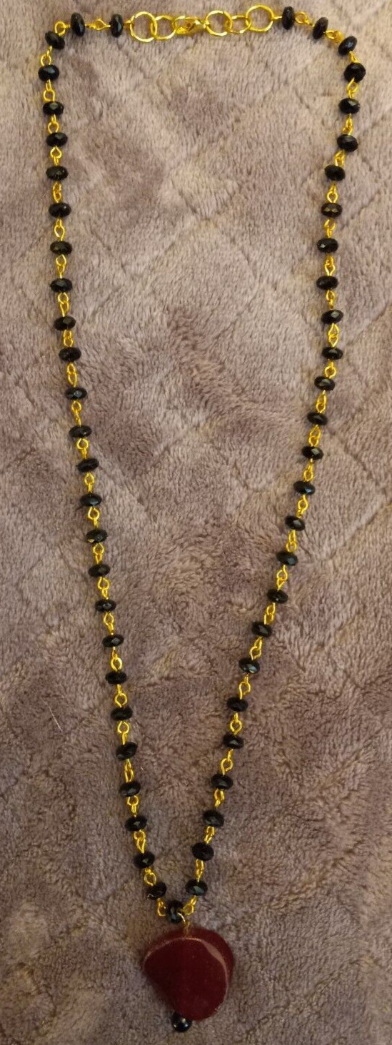 Gold And Black Necklace With A Red Glass Stone Pendant 22″