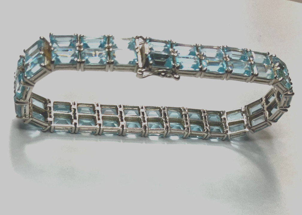 8” TENNIS BRACELET -ADI 925 STERLING SILVER – 40 EMERALD CUT TOPAZ STONES -NICE!