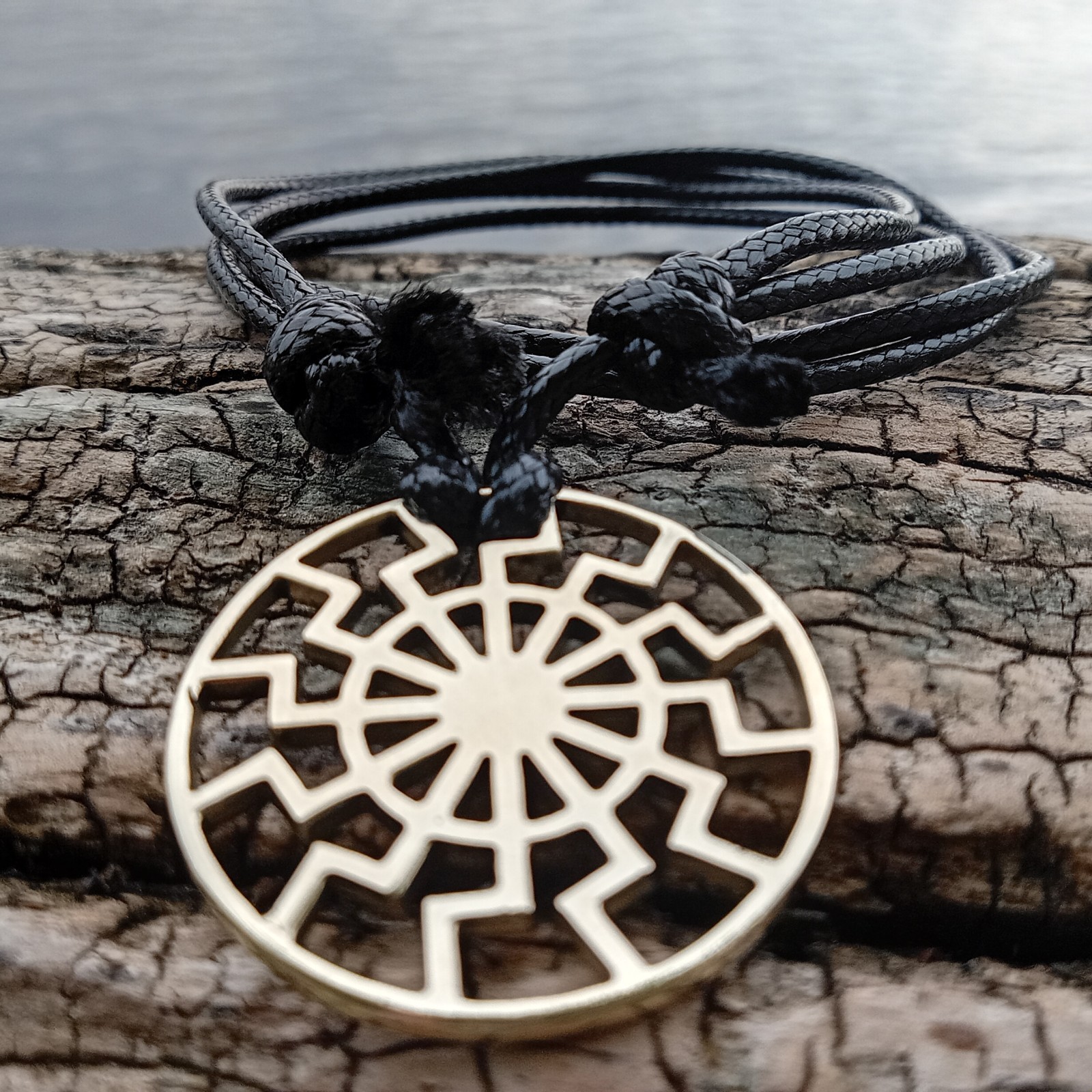 Black Sun Pendant Necklace – Brass Sonnenrad Medallion on Black Cord
