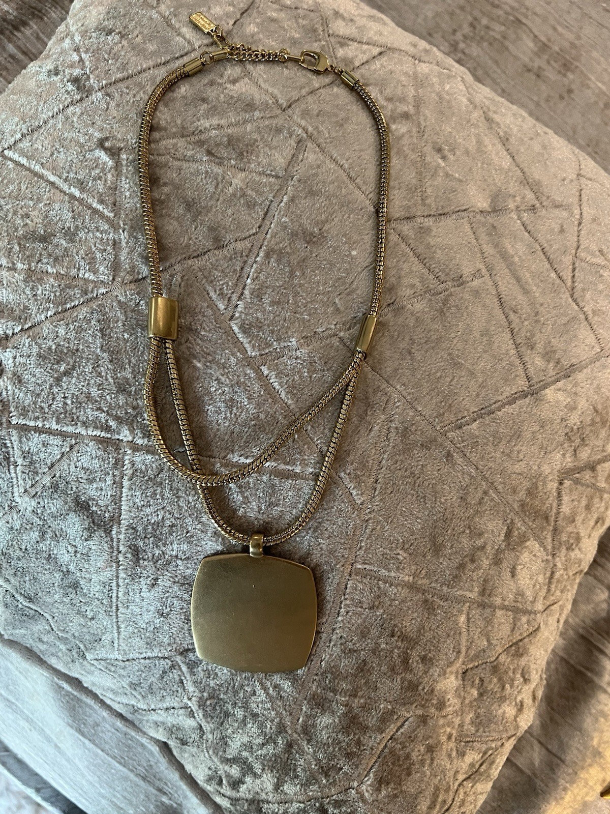 Kenneth Cole Necklace Double Serpent Chain Sporting A Large Gold Square Pendant