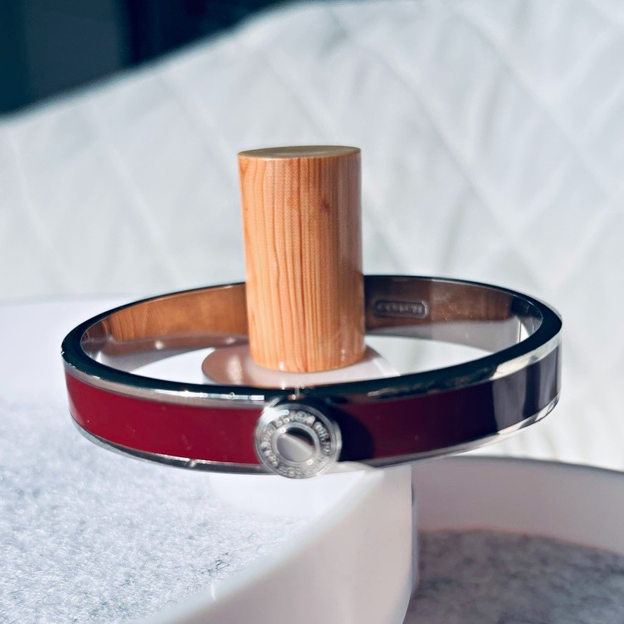 COACH Burgundy Enamel with Silver Accent and Hinged Closure Bangle Bracelet