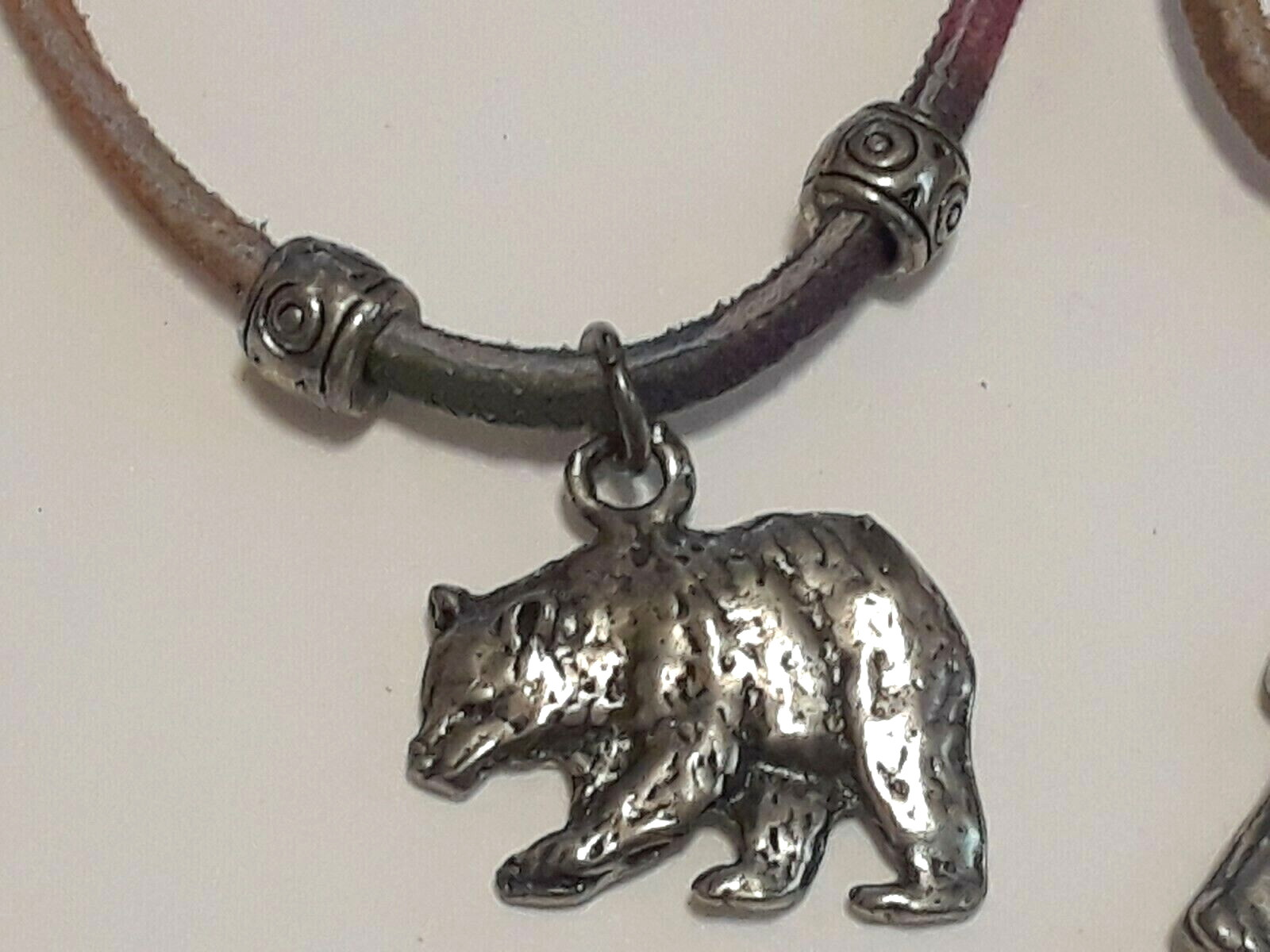 Animal shape pendants silver tone on leather rope chains 18″ long. 5 necklaces