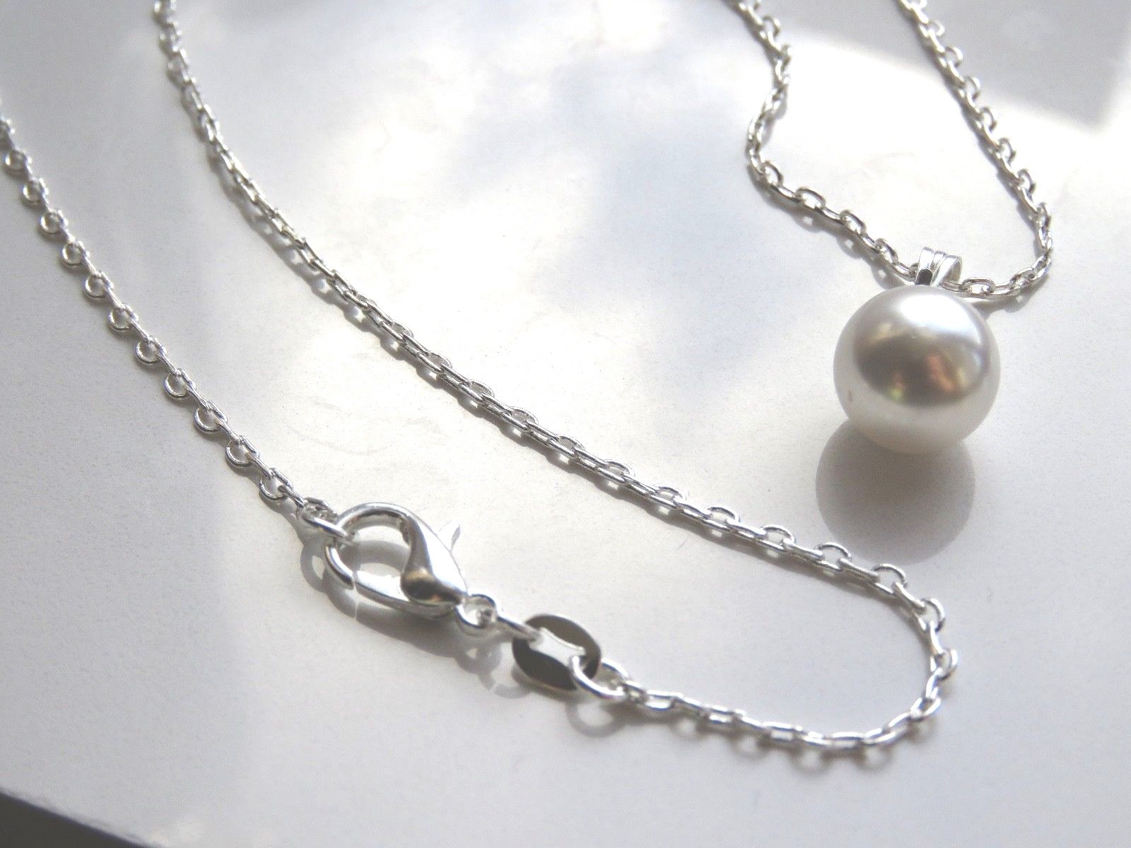 sa9. Silver Plated Necklace Made With a Swarovski White Pearl Pendant