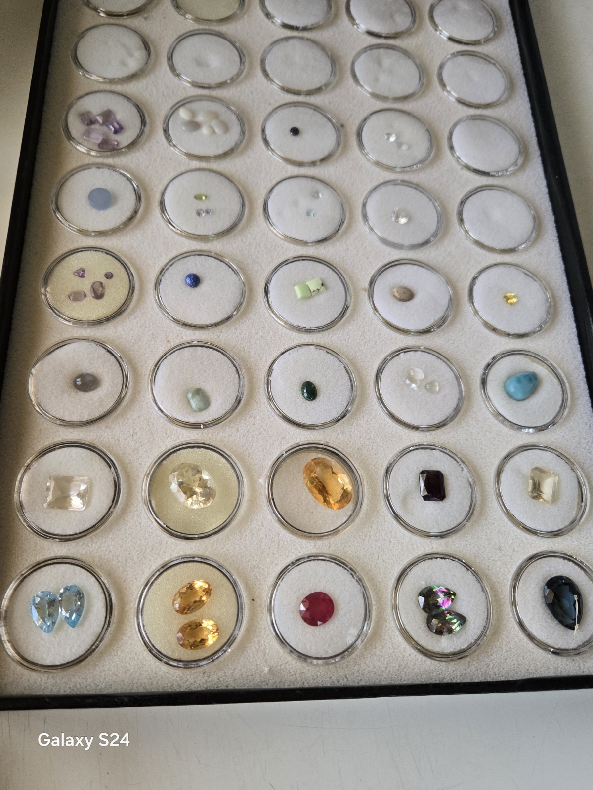 Lots Of Loose Faceted Mixed Colors Gemstones In A Display Case- ** ESTATE…