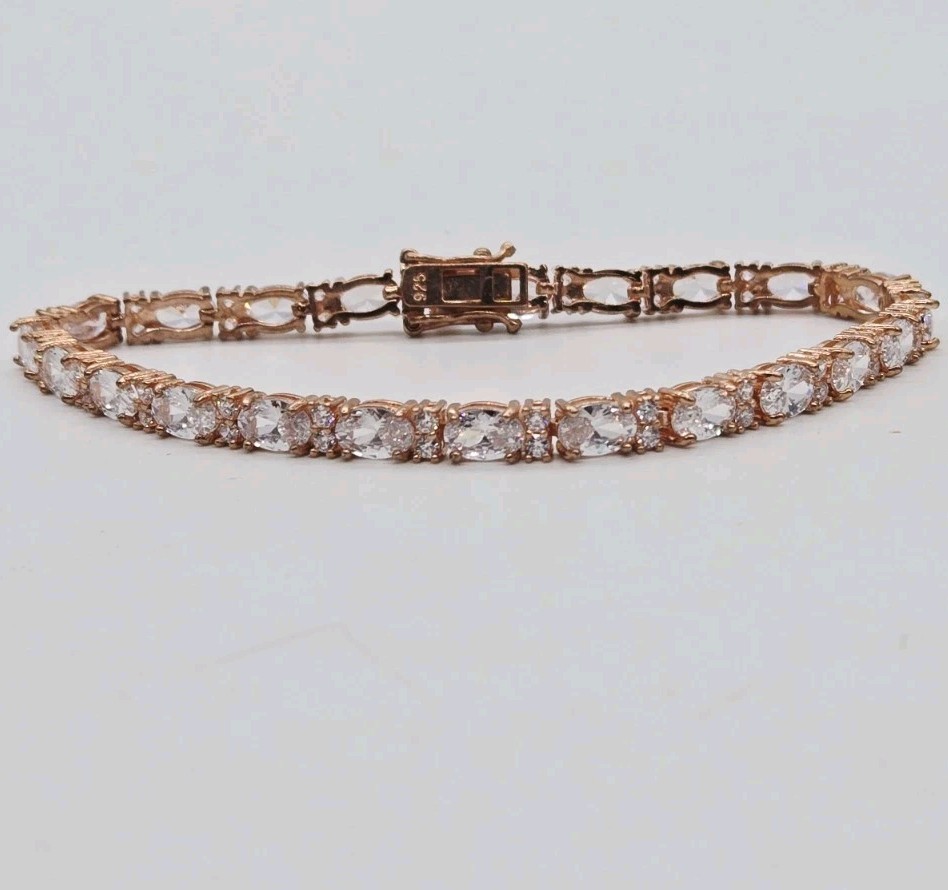 Tennis Bracelet White Oval Crystal rhinestone signed 925 Rose Gold tone 7.25 in