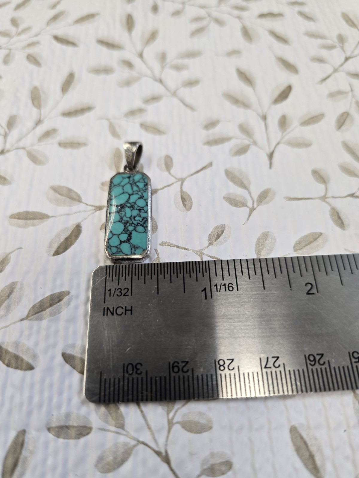 Sterling silver (925) turquoise pendant featuring a rectangular cabochon