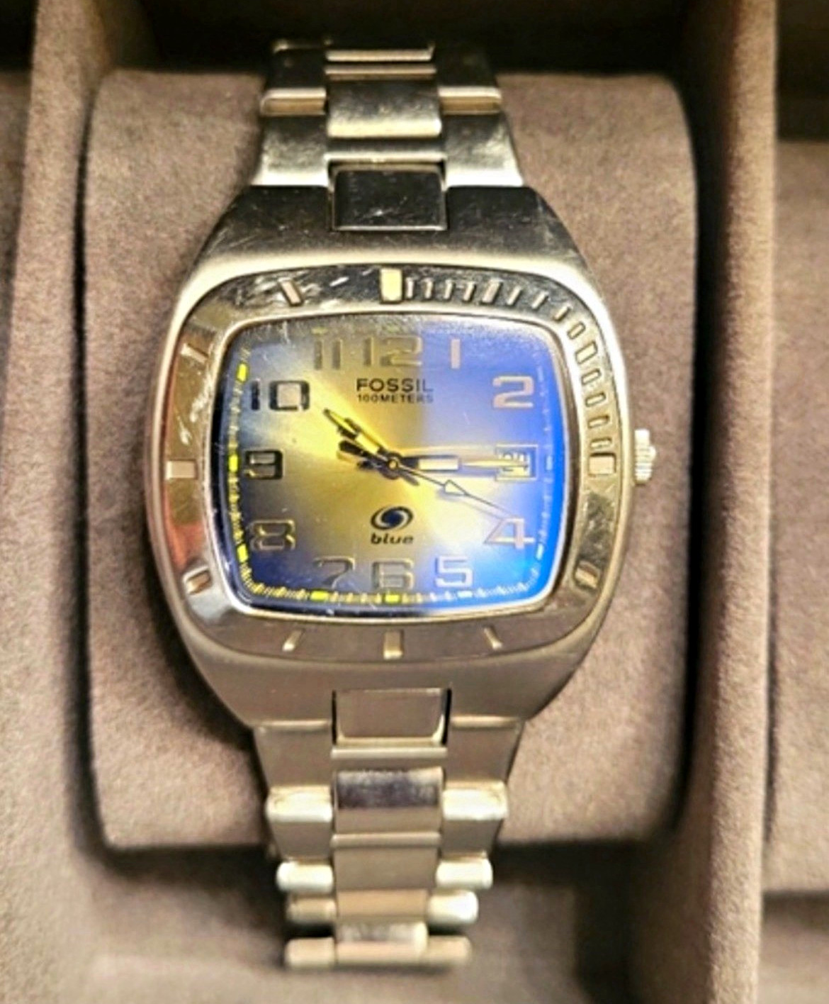Vintage Fossil Blue stainless steel watch with Blue-to-Yellow Gradient Dial.