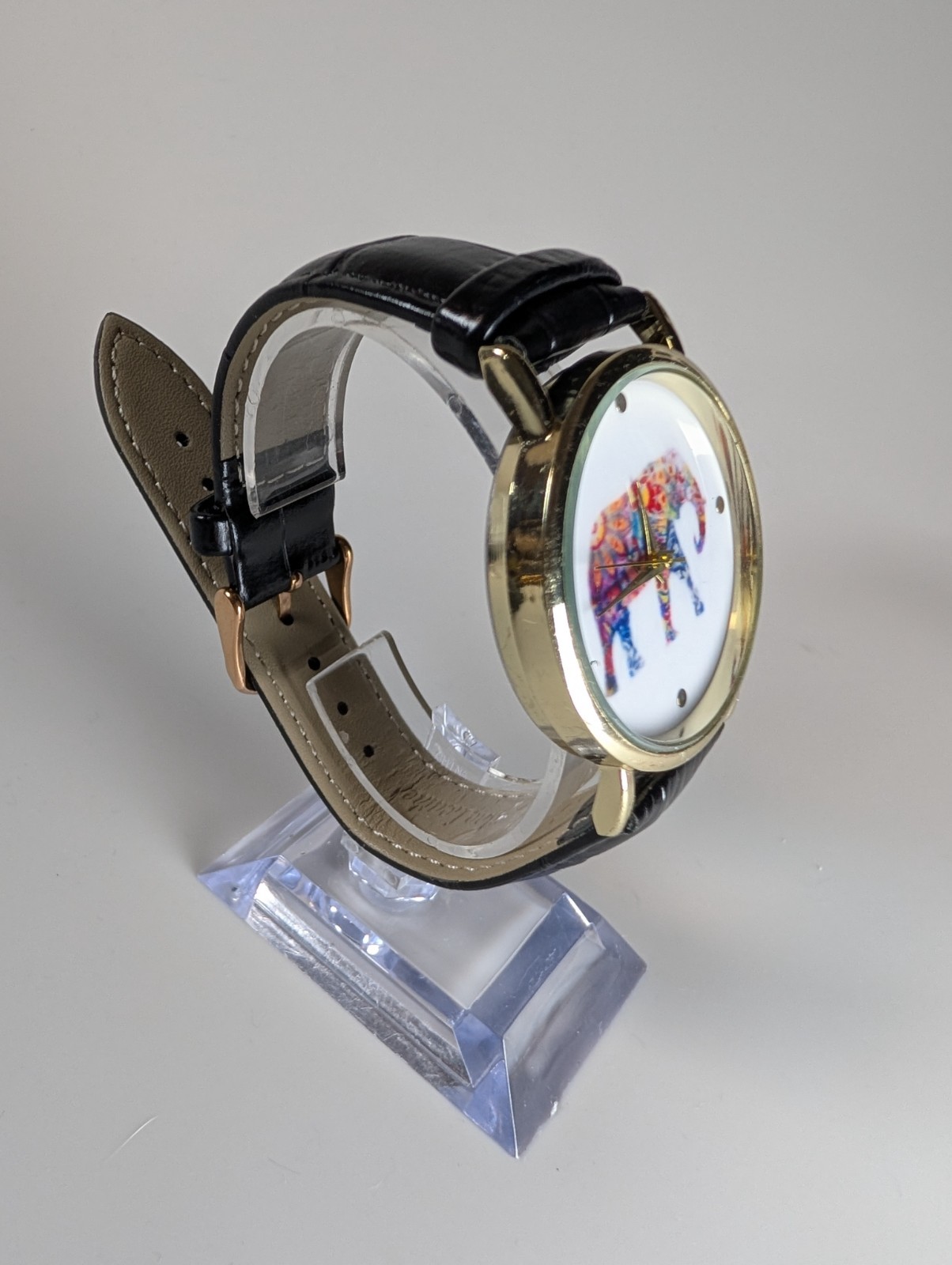 Elephant watch with flower pattern and dot indexes black leather band