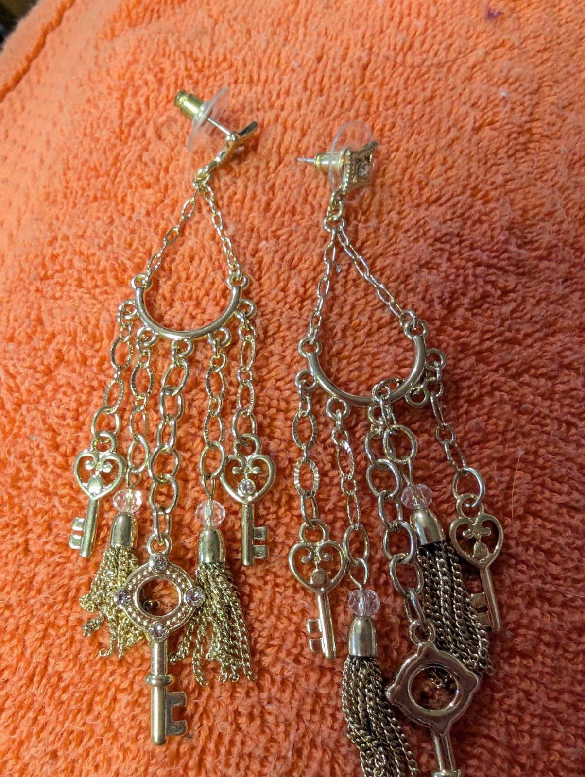 Earrings With Dangling Chains And Various Pendants