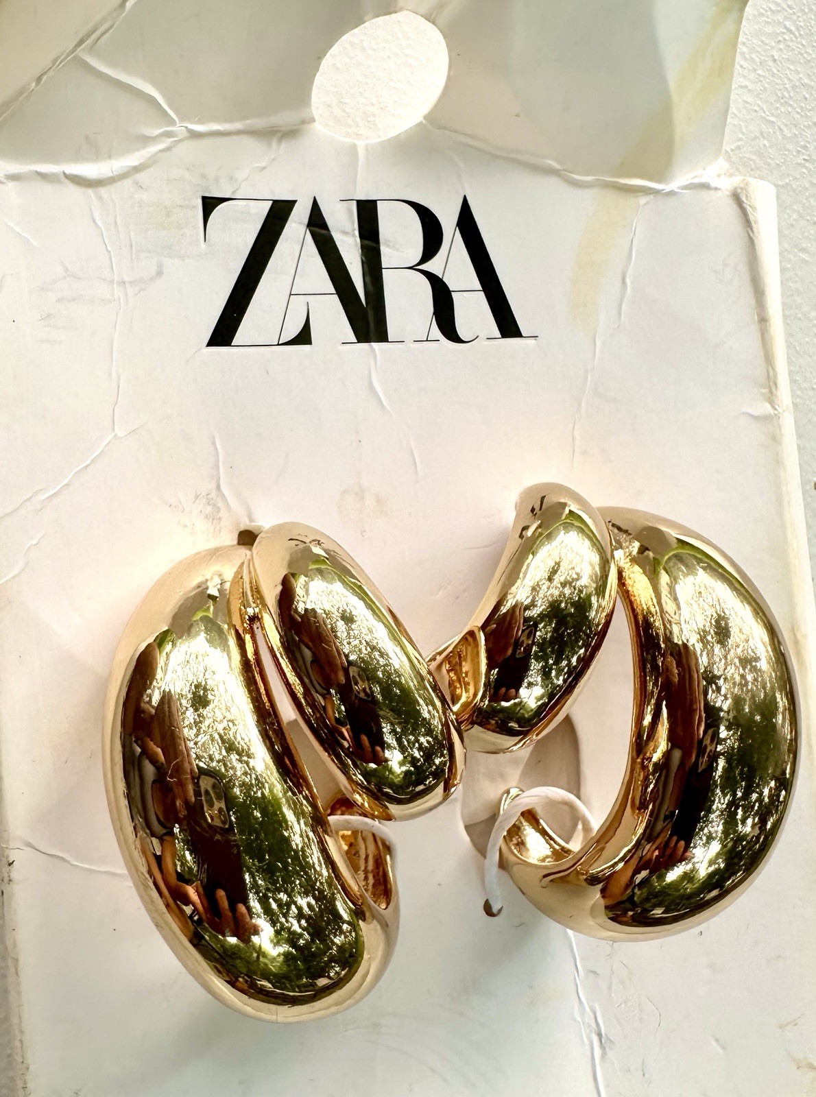 Zara Double Teardrop Earrings in gold.