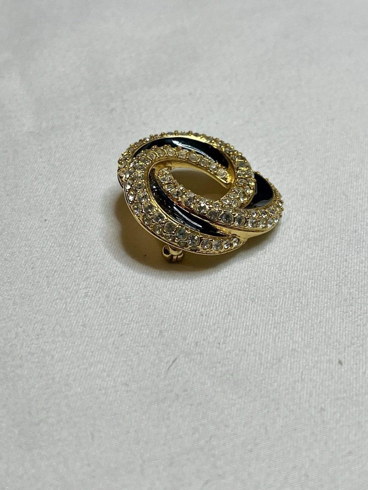 Signed Swarovski Gold Tone Clear Crystal Black Enamel Love Knot Brooch Pin