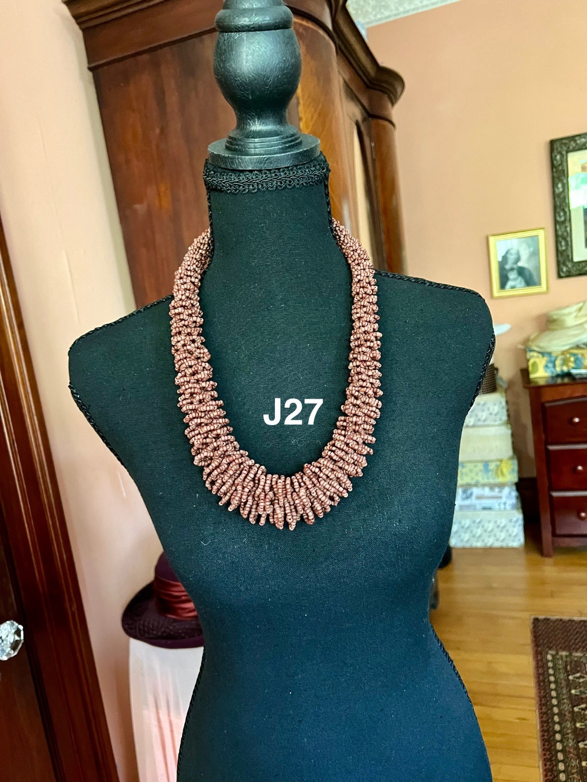 This piece is a chunky, multi-strand seed bead loop necklace.