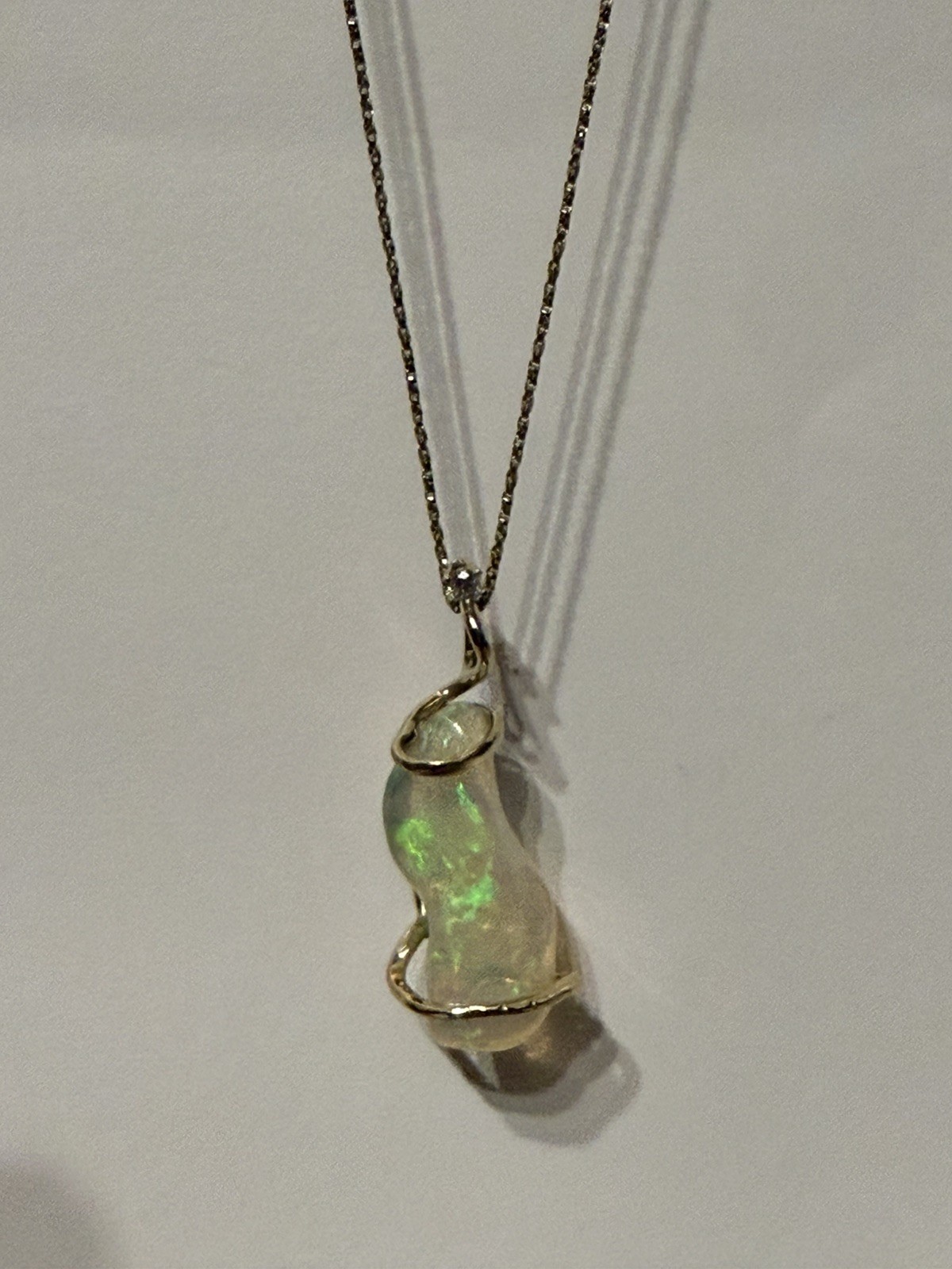14k Solid Gold 4.90 carats opal and diamond pendant .