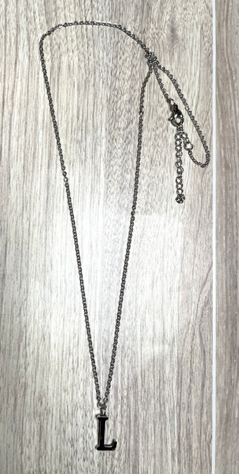 Stainless steel L on chain – 1/2″ x 3/8″ charm, 18″ chain (2″ extender)