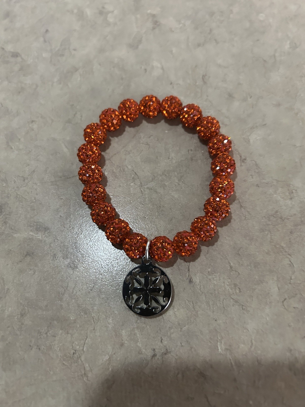 Rustic Orange Stretch Beaded Bracelet With Logo Charm