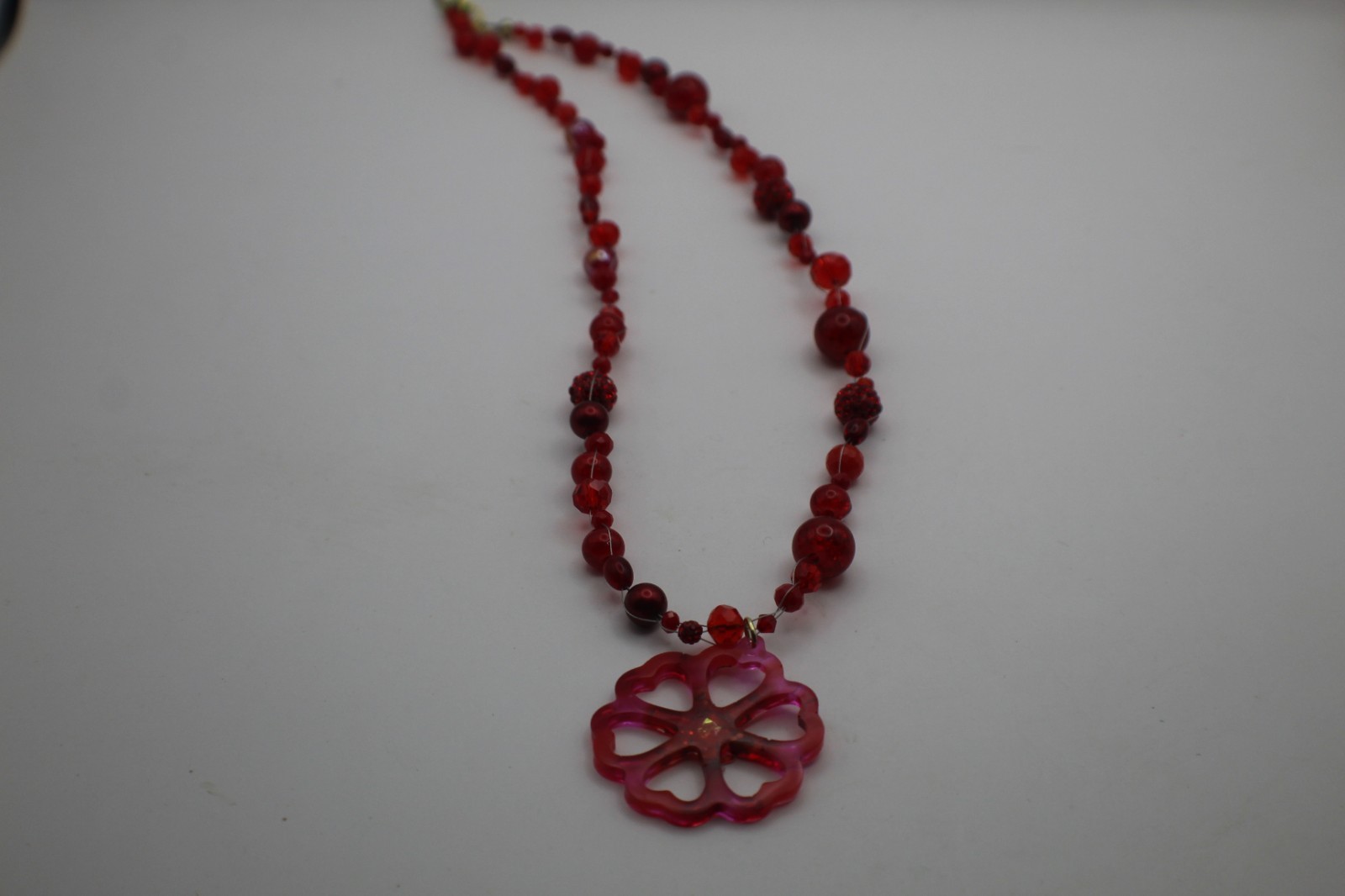 50 Shades Of Red Resin Flower Pendant On A Floating Beaded Necklace