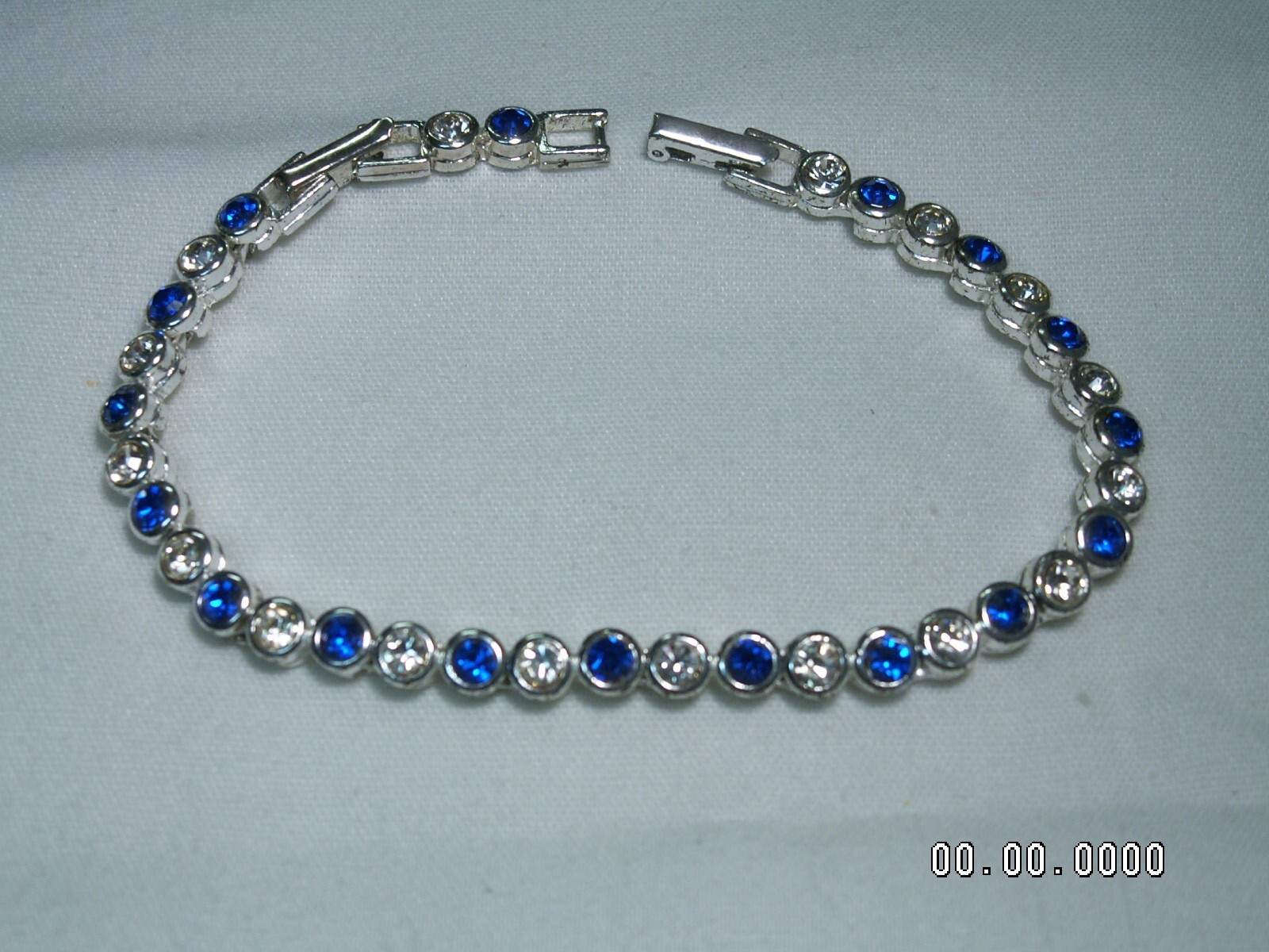 2002 AVON…Silver Tone,Sapphire Blue Crystals Bracelet & Pierced Earrings Set