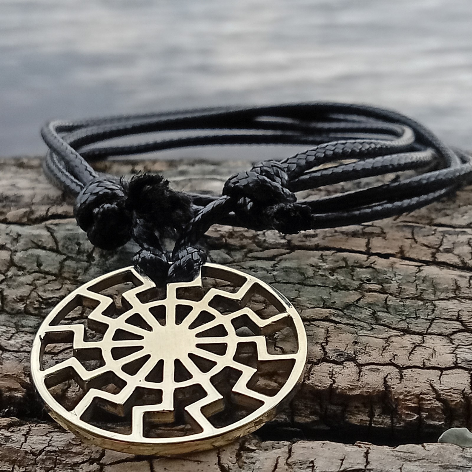 Black Sun Pendant Necklace – Brass Sonnenrad Medallion on Black Cord
