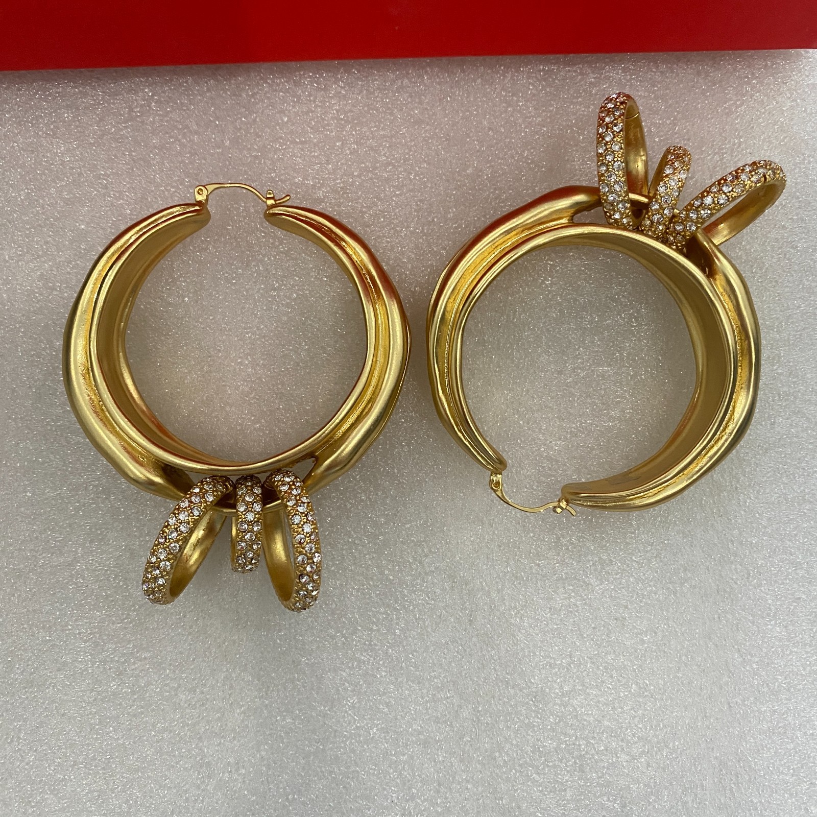 Schiaparelli Asymmetrical Twisted Gold Hoop Earrings With Pave Crystal Rings