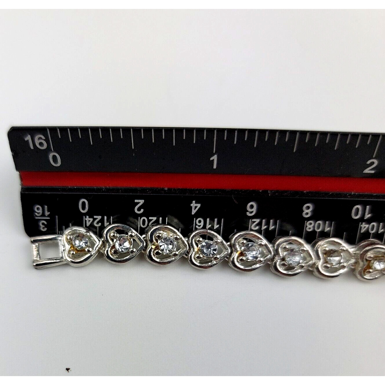 Heart Shaped Tennis Bracelet Silver Tone Link with Rhinestones Fold Over Clasp