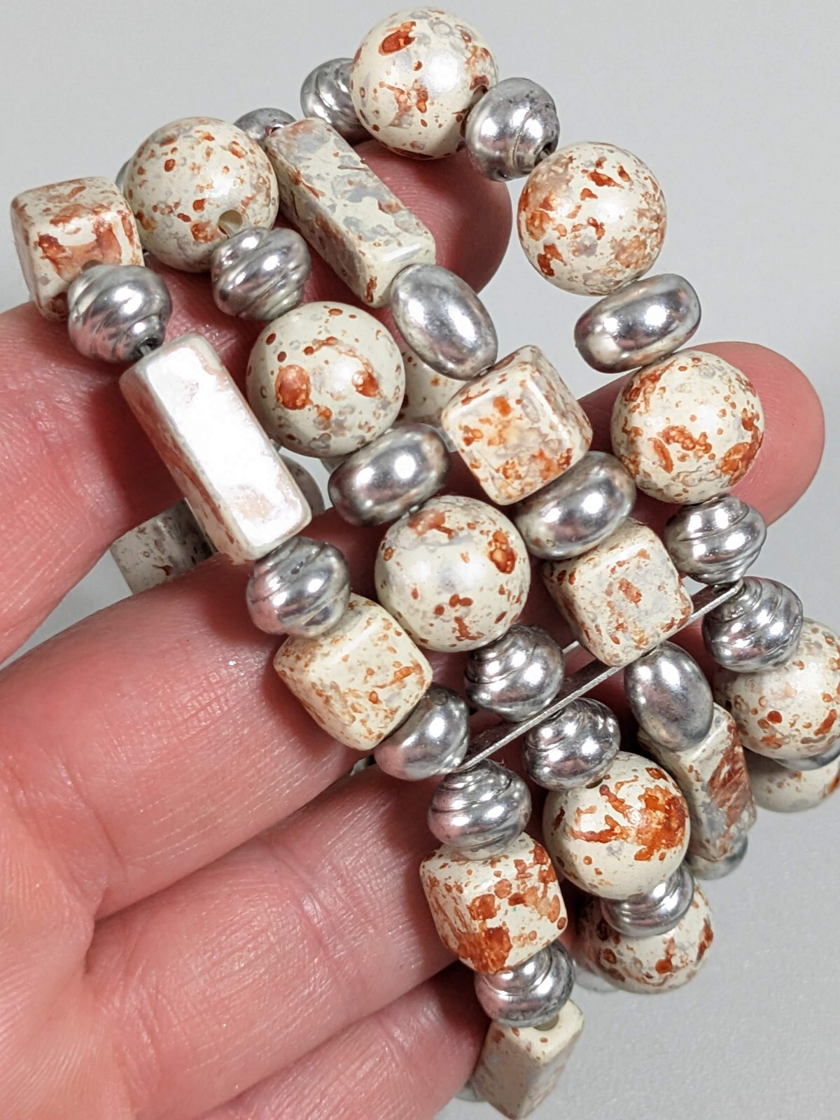Silver Tone Ivory Color Brown Splatter Four Row Wide Stretch Bracelet 6 inches