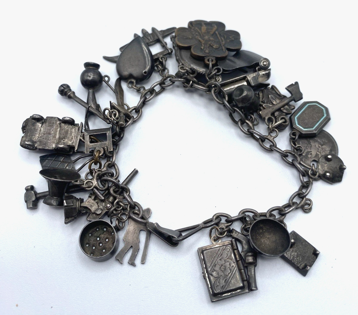 Old Charm Bracelet Sterling Silver, 27 Charms, Fuel Truck, Jeep, Cannon 7 1/2″