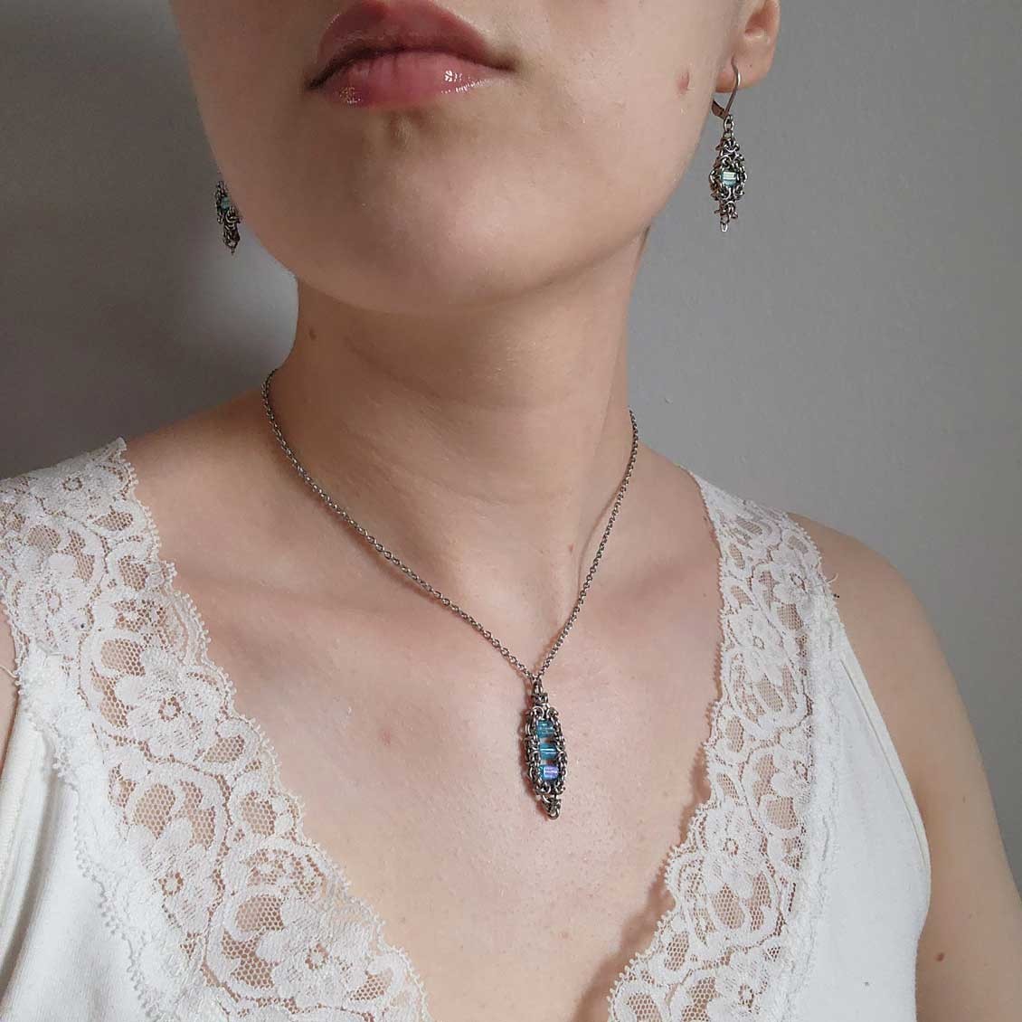 Silver and teal dangly lever back earrings made of stainless steel