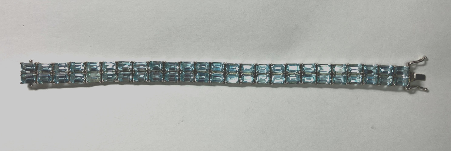 8” TENNIS BRACELET -ADI 925 STERLING SILVER – 40 EMERALD CUT TOPAZ STONES -NICE!